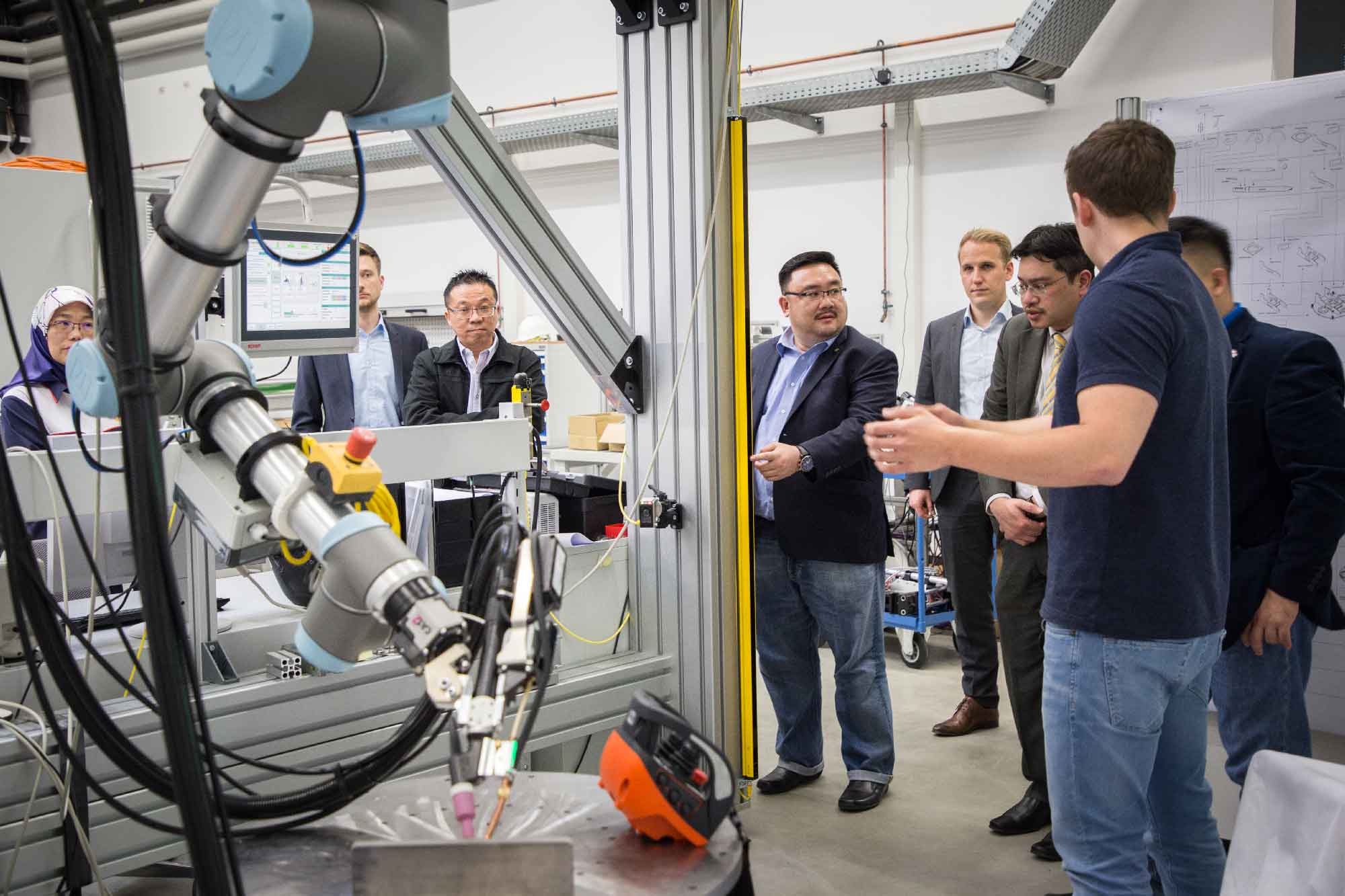 Guests learn about collaborative robotics technologies through demonstrations.